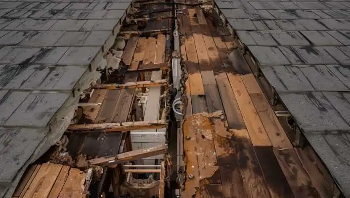 Cracked roof tiles and underlayment exposure needing professional repair in Chino Valley.